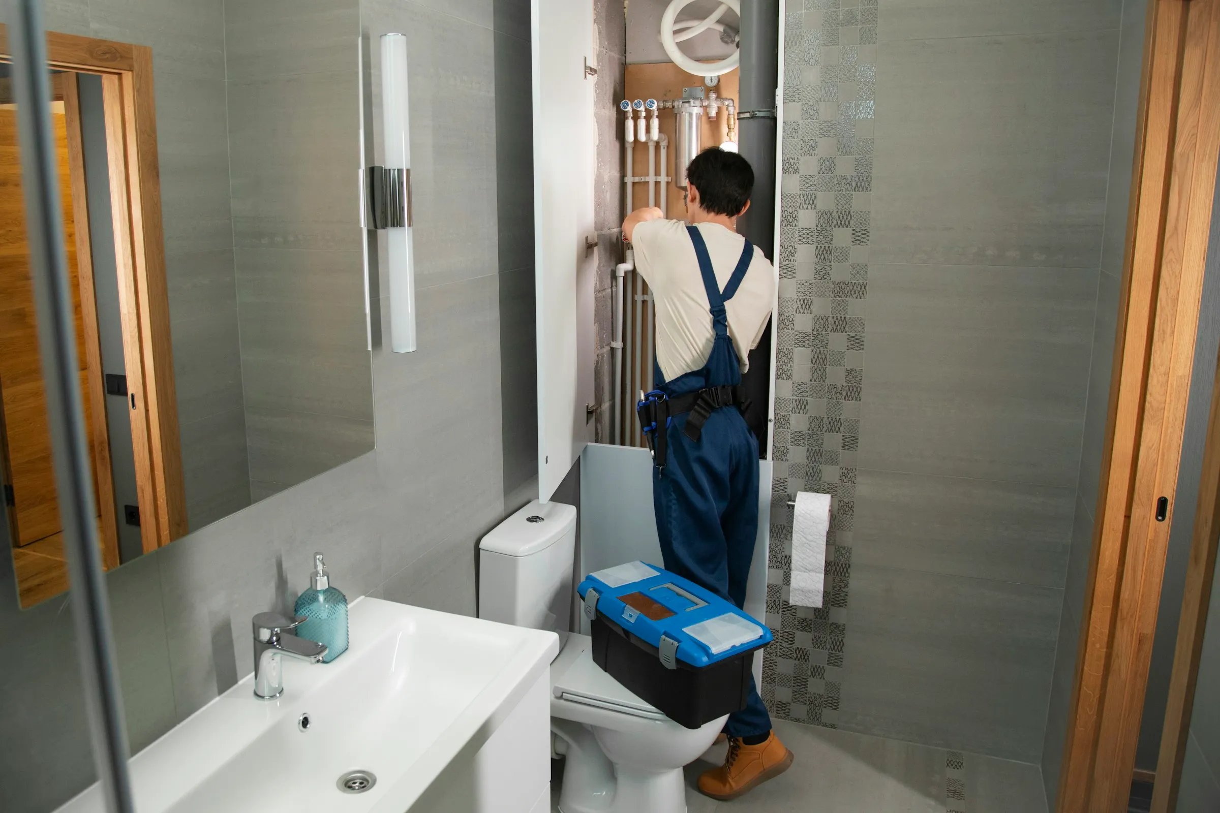 Plumbing maintenance in a modern bathroom